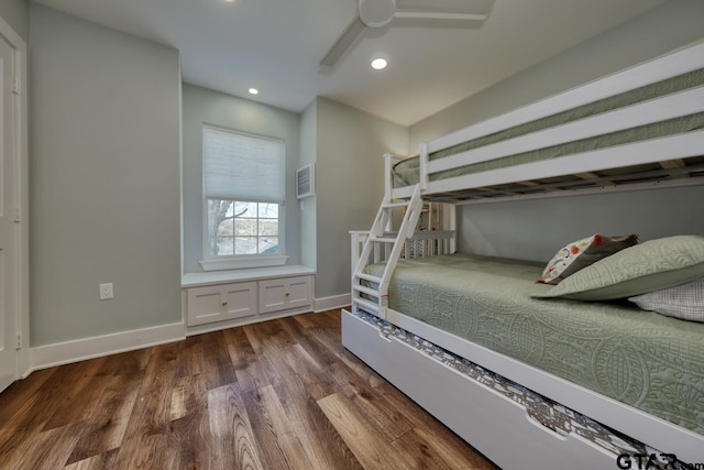 unfurnished bedroom with dark wood-type flooring and ceiling fan