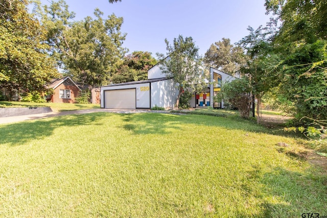 view of yard featuring a garage