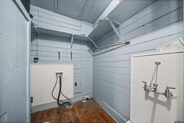 laundry room with wooden walls, dark hardwood / wood-style flooring, and hookup for a washing machine