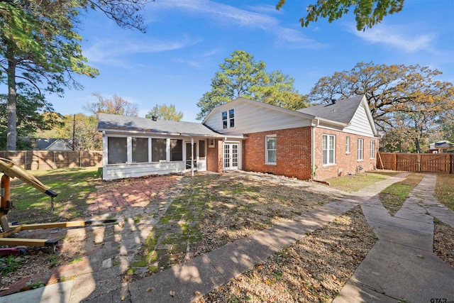 view of front of property with a sunroom