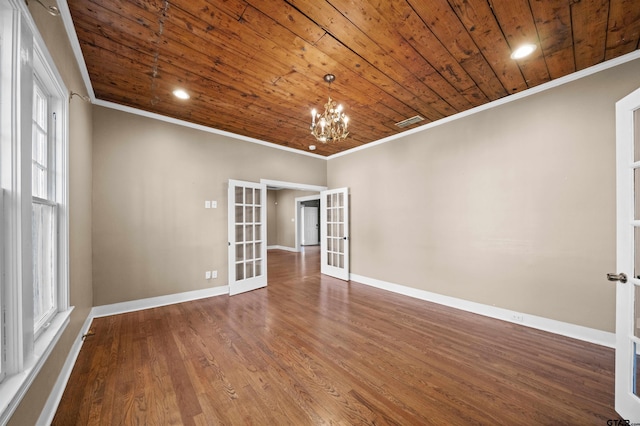 unfurnished room with crown molding, french doors, wood ceiling, and wood-type flooring