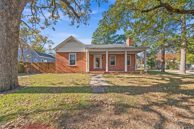 view of front of house featuring a front yard and covered porch