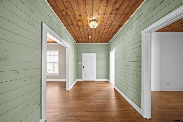 interior space with wooden walls, hardwood / wood-style floors, and wood ceiling