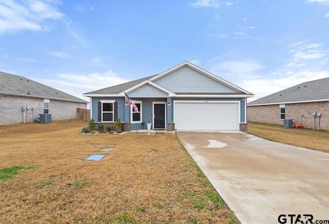 881 Martin St, Chandler, TX 75758 - craftsman-style house with a garage, driveway, a front yard, and brick siding