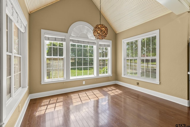 unfurnished sunroom featuring lofted ceiling