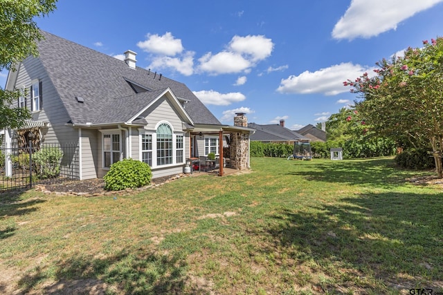 back of property featuring a patio and a lawn