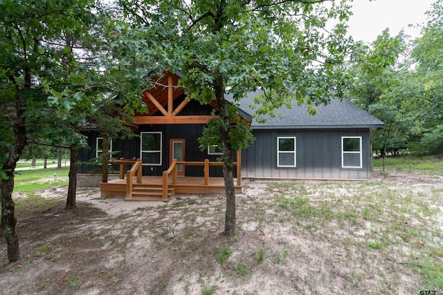 view of front of property with a wooden deck