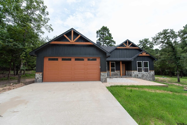 view of front facade with a garage and a front lawn