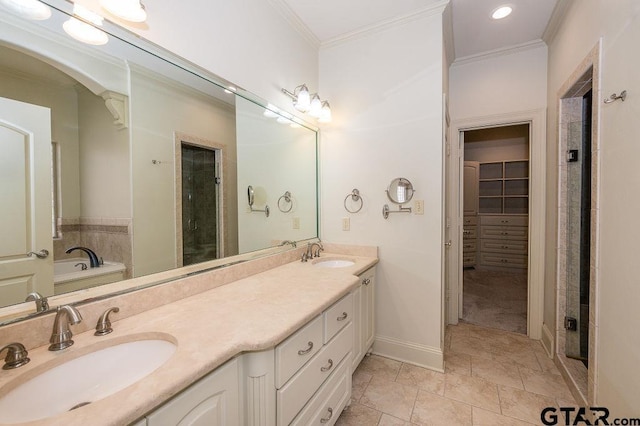 bathroom with vanity, ornamental molding, and separate shower and tub