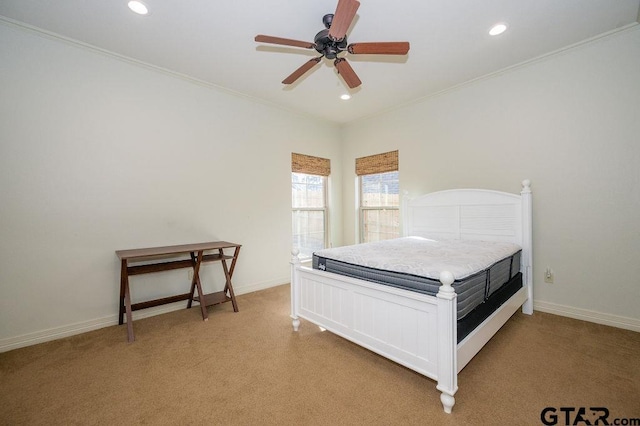 bedroom with ornamental molding, carpet, and ceiling fan