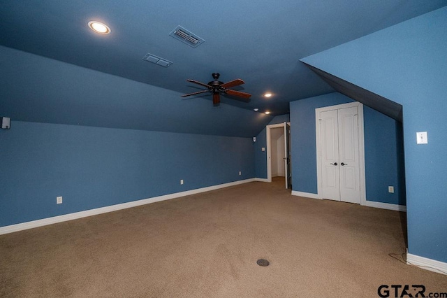 bonus room featuring lofted ceiling, carpet flooring, and ceiling fan