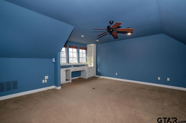 additional living space with vaulted ceiling, ceiling fan, and carpet floors