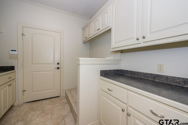 clothes washing area featuring ornamental molding