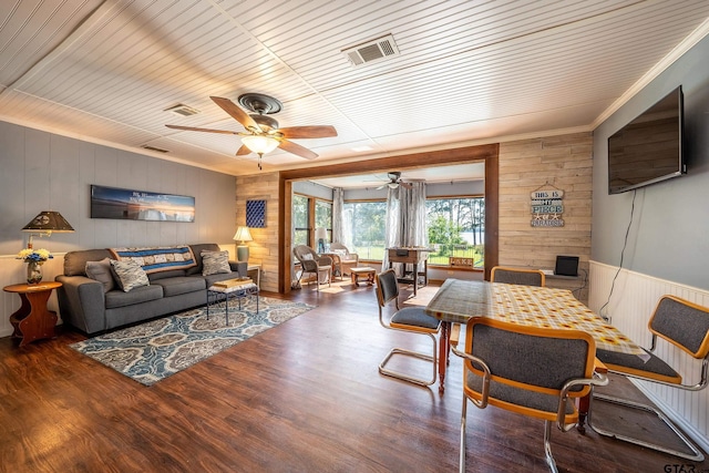 living room with ceiling fan, dark hardwood / wood-style flooring, wood ceiling, and ornamental molding