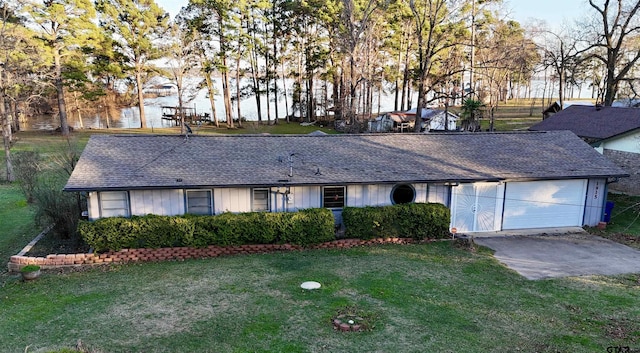 single story home featuring a front yard and a garage