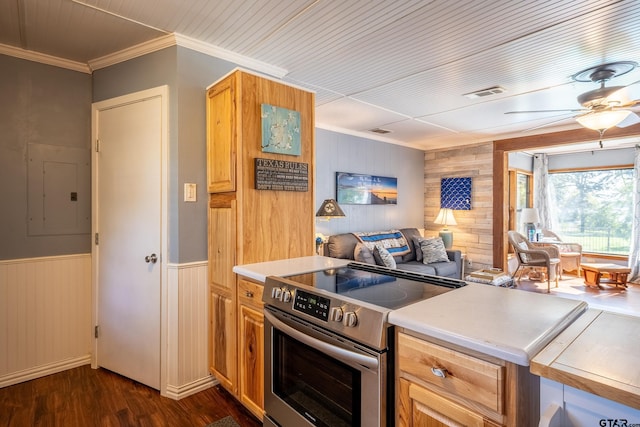 kitchen featuring ornamental molding, ceiling fan, dark wood-type flooring, electric stove, and electric panel