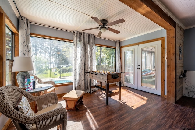 sunroom / solarium featuring ceiling fan and french doors