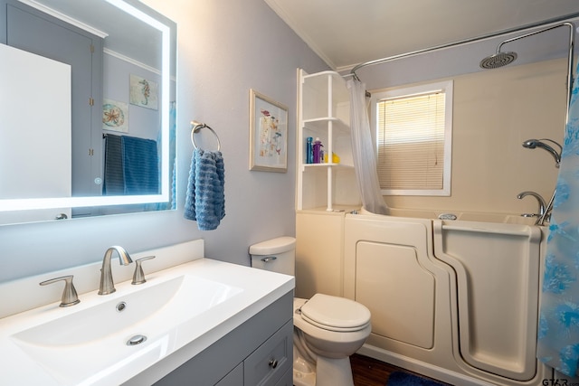 full bathroom featuring shower / tub combo, vanity, toilet, and ornamental molding