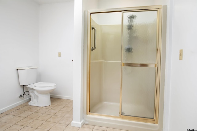 2759 Lake Breeze Dr, Chandler, TX 75758 - bathroom featuring a shower stall, toilet, baseboards, and tile patterned flooring