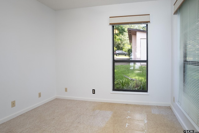 2759 Lake Breeze Dr, Chandler, TX 75758 - tiled spare room featuring baseboards