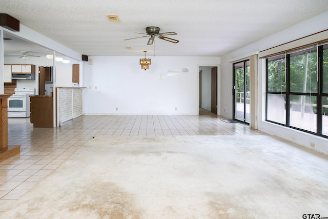 2759 Lake Breeze Dr, Chandler, TX 75758 - unfurnished living room with ceiling fan, light tile patterned floors, and baseboards