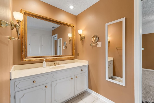 507 Hyde Park, Tyler, TX 75701 - bathroom with a textured ceiling, vanity, and tile patterned floors