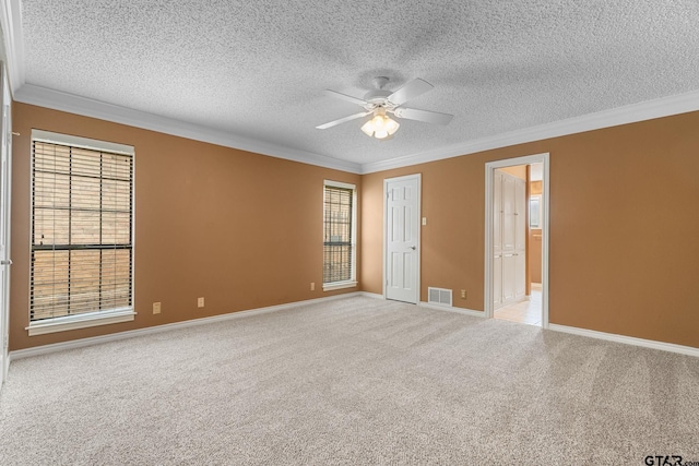 507 Hyde Park, Tyler, TX 75701 - carpeted empty room featuring crown molding, ceiling fan, a textured ceiling, and plenty of natural light