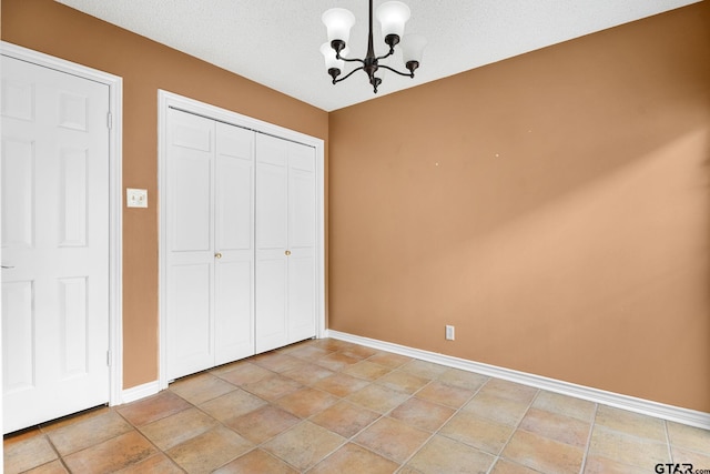 507 Hyde Park, Tyler, TX 75701 - unfurnished bedroom featuring a chandelier and a closet