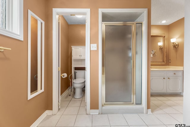 507 Hyde Park, Tyler, TX 75701 - full bath with a textured ceiling, a shower stall, tile patterned floors, and vanity