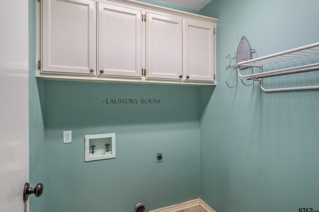 clothes washing area with hookup for a washing machine, cabinet space, and hookup for an electric dryer