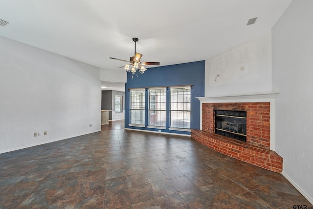 unfurnished living room with visible vents, baseboards, a brick fireplace, and ceiling fan