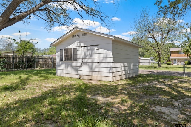 view of outdoor structure with an outbuilding and a fenced backyard