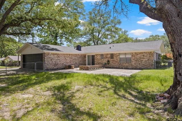 ranch-style house with a patio, fence, a front lawn, and brick siding