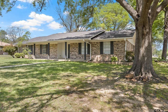 single story home featuring brick siding and a front lawn