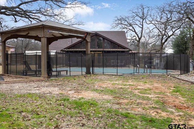 view of yard featuring a gazebo and a fenced in pool