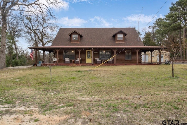 view of front facade with a front lawn and covered porch