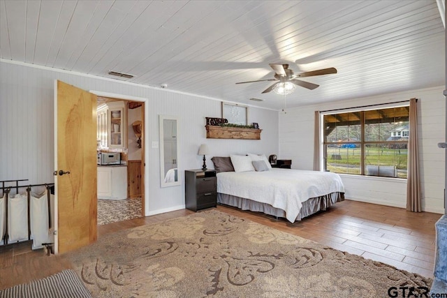 bedroom with wood ceiling, ceiling fan, and hardwood / wood-style floors