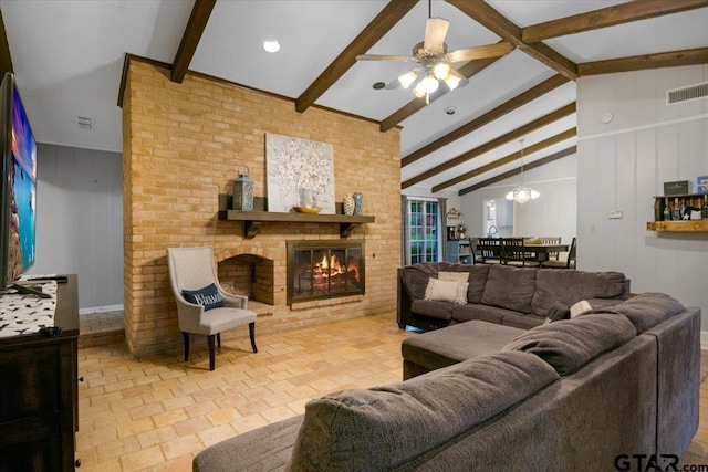 800 Neches Dr, Tyler, TX 75702 - living area featuring a brick fireplace, a ceiling fan, and a chandelier