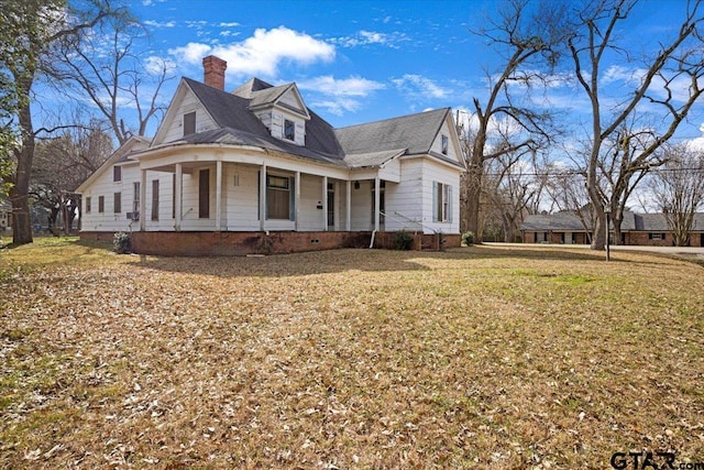 view of front of property with a front yard and a porch