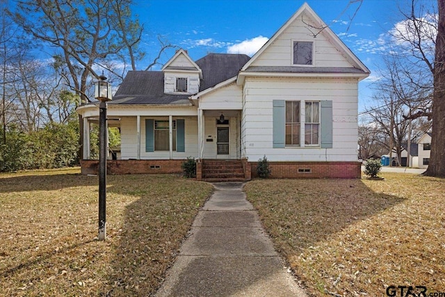 view of front facade featuring a front yard and covered porch