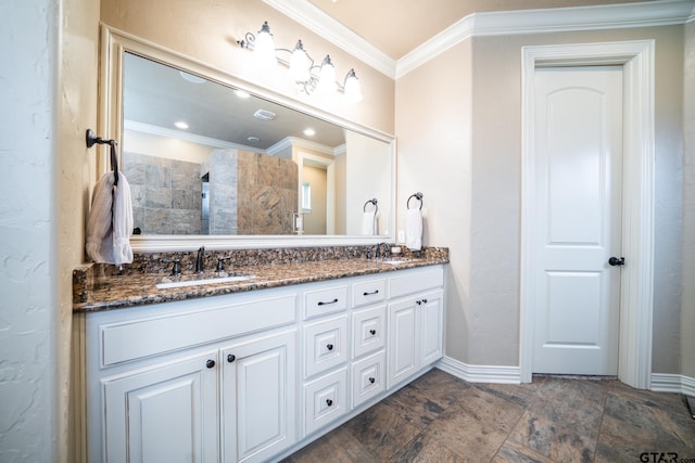 bathroom with crown molding and vanity