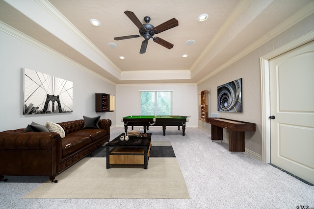 playroom featuring a tray ceiling, light colored carpet, ceiling fan, crown molding, and billiards