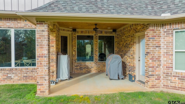 doorway to property featuring a patio area and ceiling fan