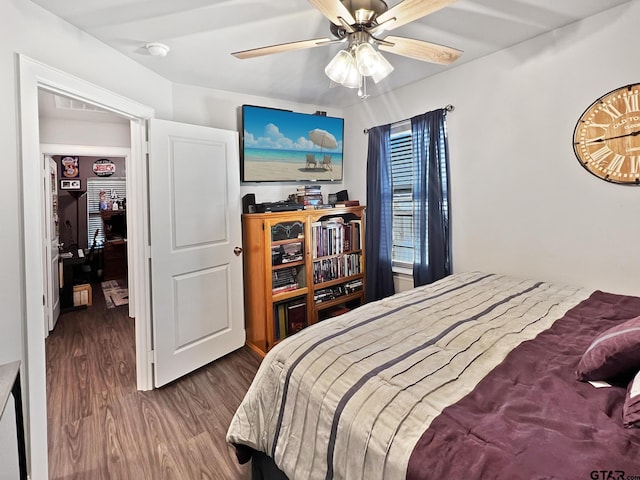 bedroom with ceiling fan and hardwood / wood-style floors