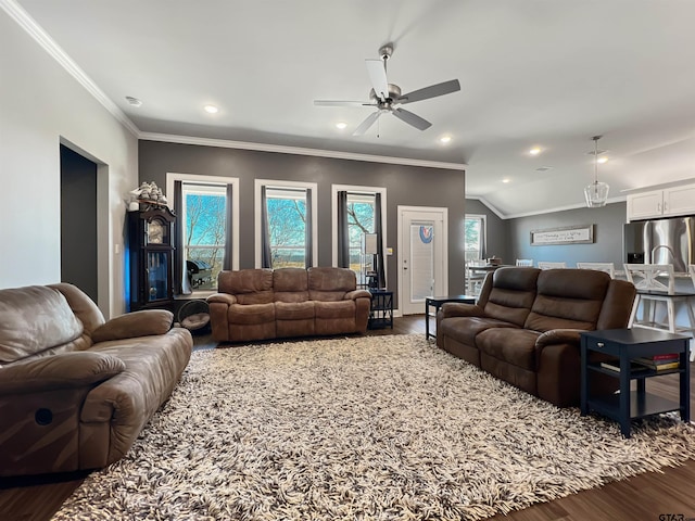 living room featuring ornamental molding, dark wood-style flooring, and recessed lighting