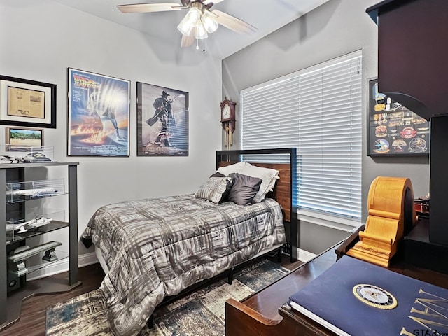 bedroom with dark wood-type flooring and ceiling fan