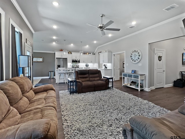 living room featuring dark hardwood / wood-style flooring, ornamental molding, and ceiling fan