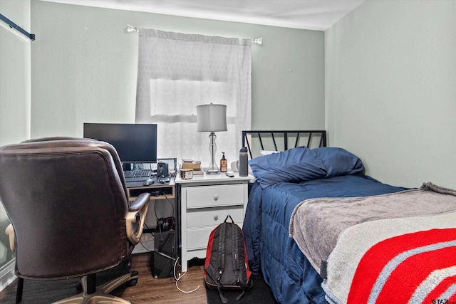 bedroom featuring dark hardwood / wood-style flooring