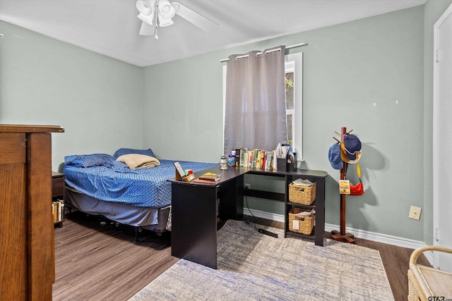 bedroom with ceiling fan and hardwood / wood-style flooring