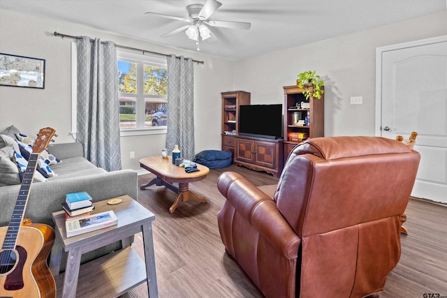 living room with ceiling fan and light hardwood / wood-style floors